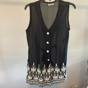 See-through vest. Beautiful diaphanous black vest with detailed embroidery.